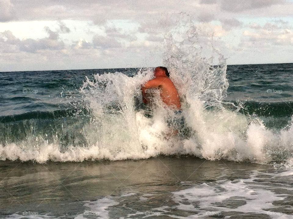 Man Crashing Into Waves