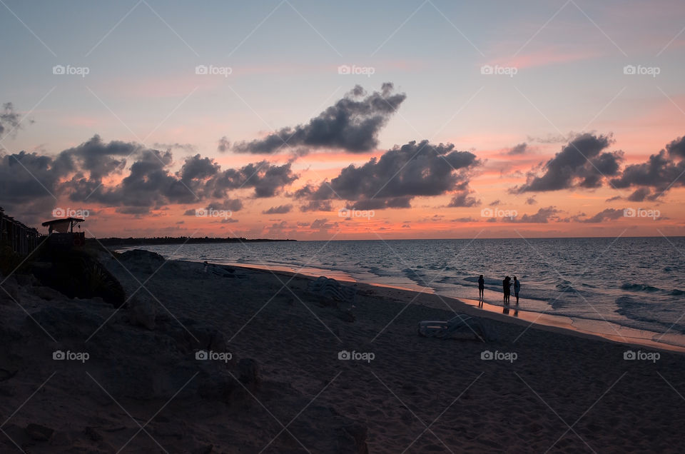 a walk on the beach with an amazing looking sky