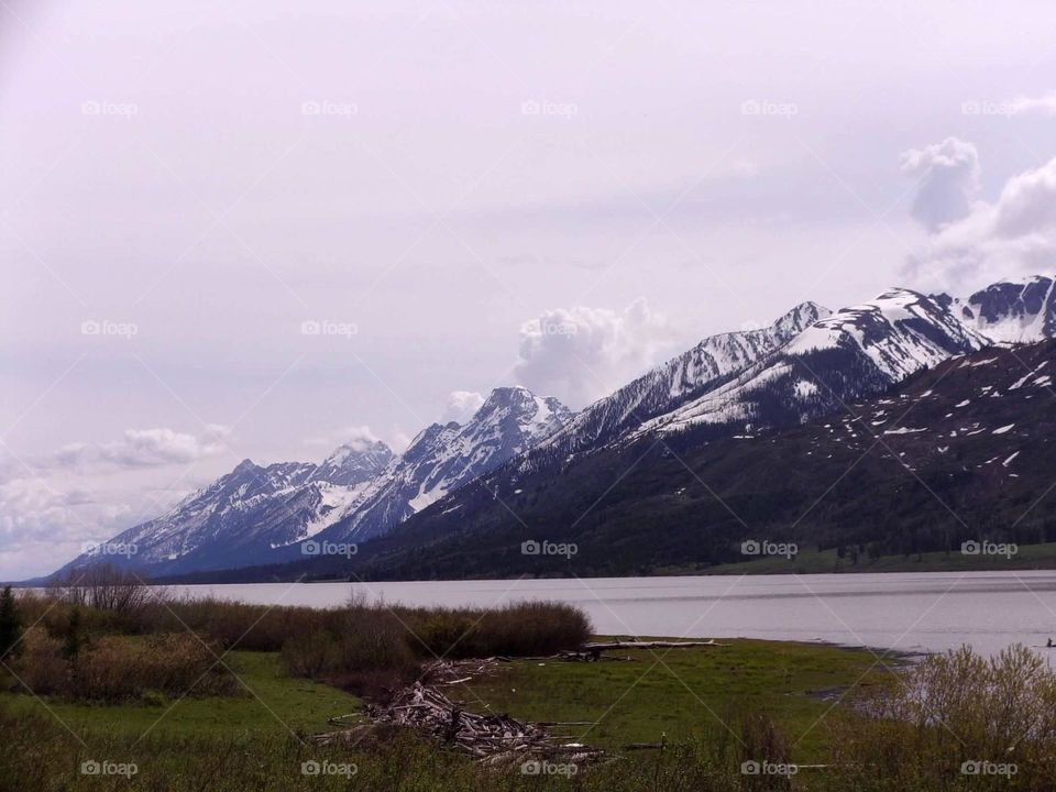 Gorgeous mountains beyond a calm river. 