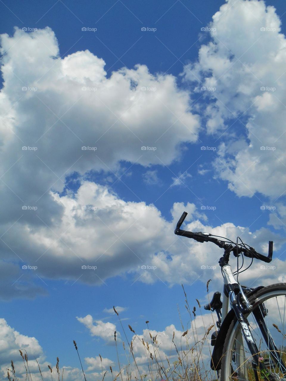 bike blue sky clouds background view from the ground