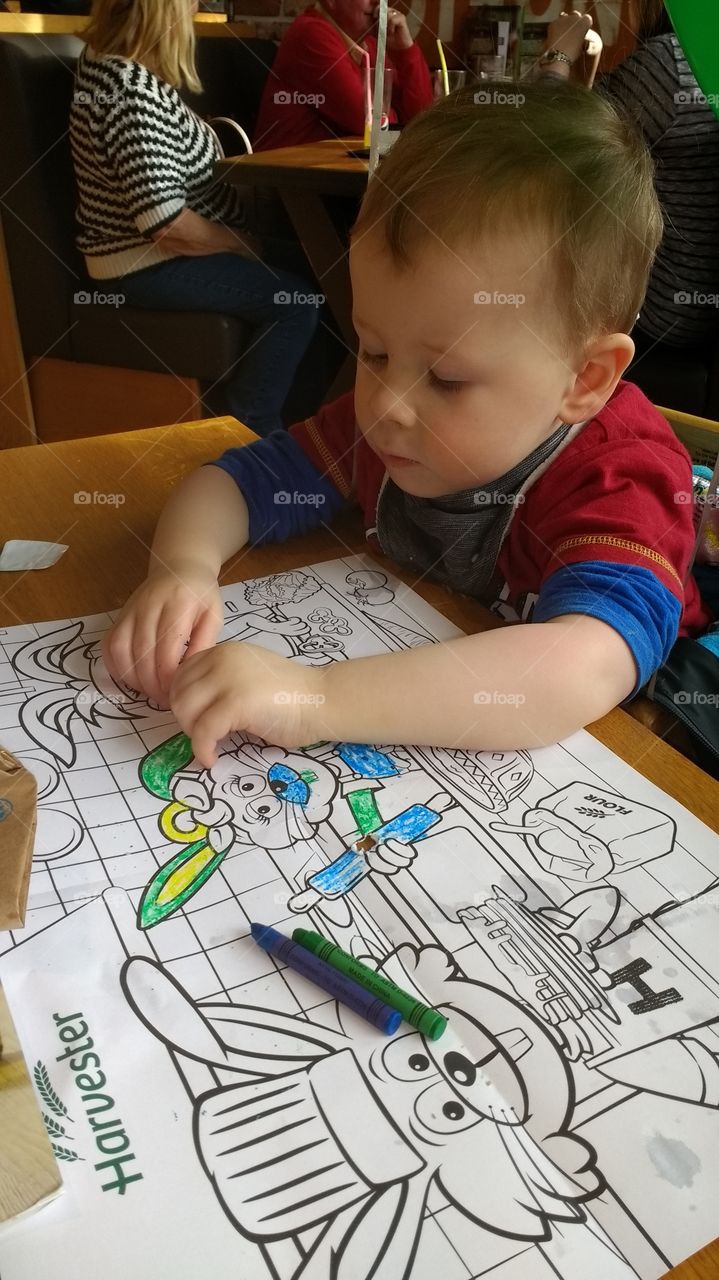 Boy colouring in