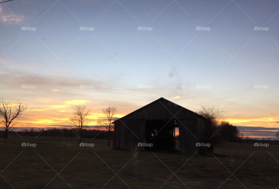 Sunset thru the barn