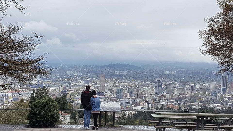 Couple overlooking the Portland skyline