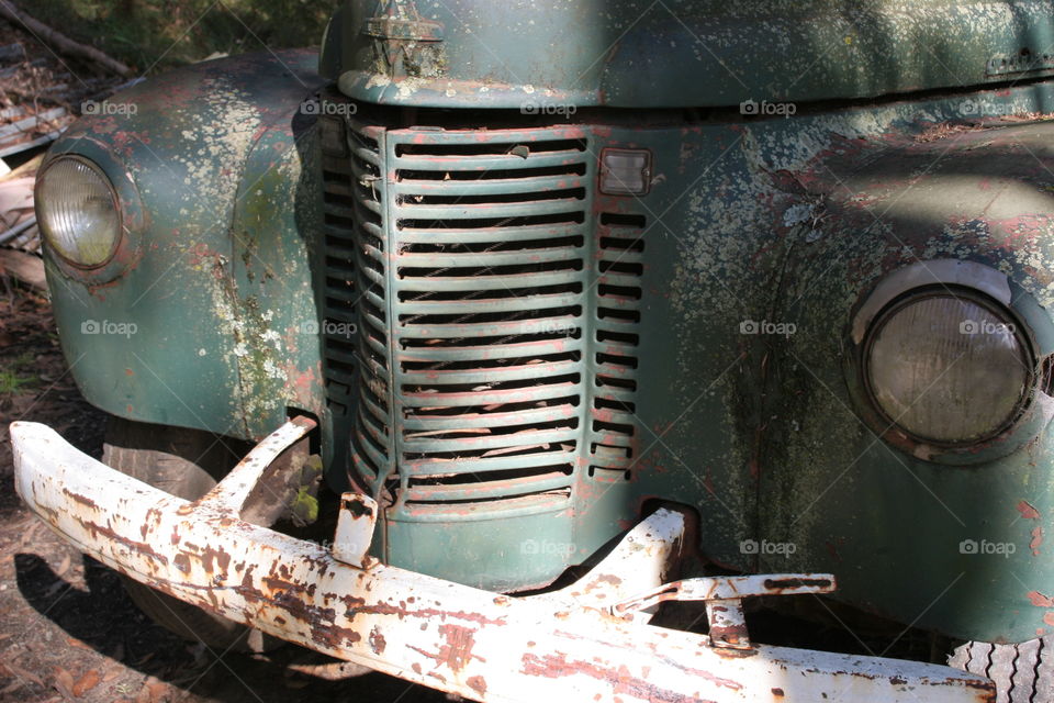 Rusting green International truck