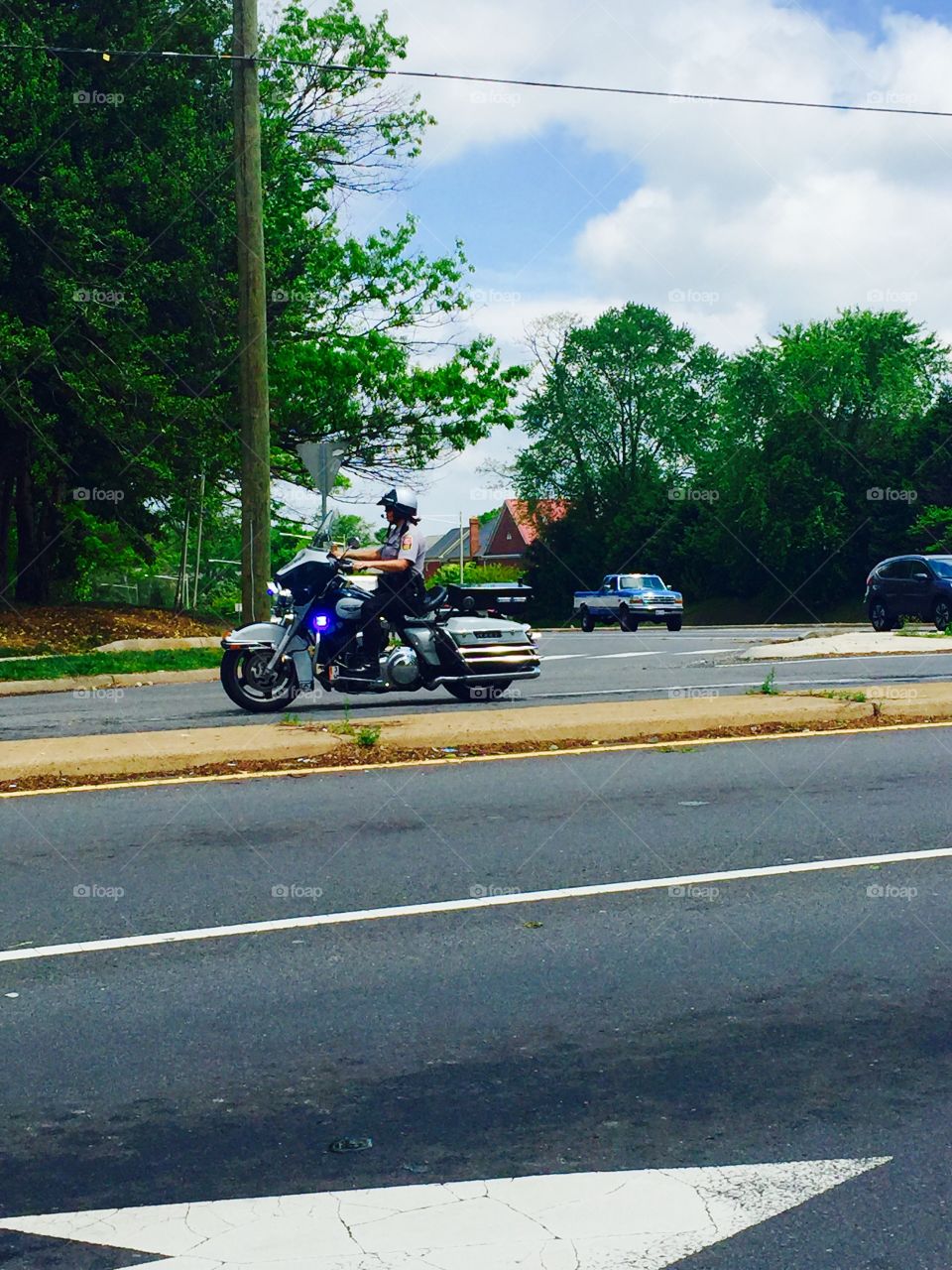 Single Police motorcycle motorcade 