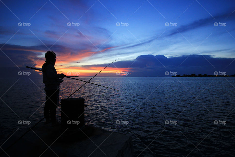 fishing in dusk in pramuka island