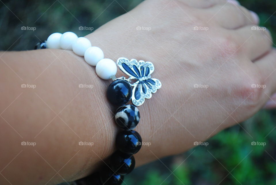 A beautiful handmade bracelet with a butterfly pendant