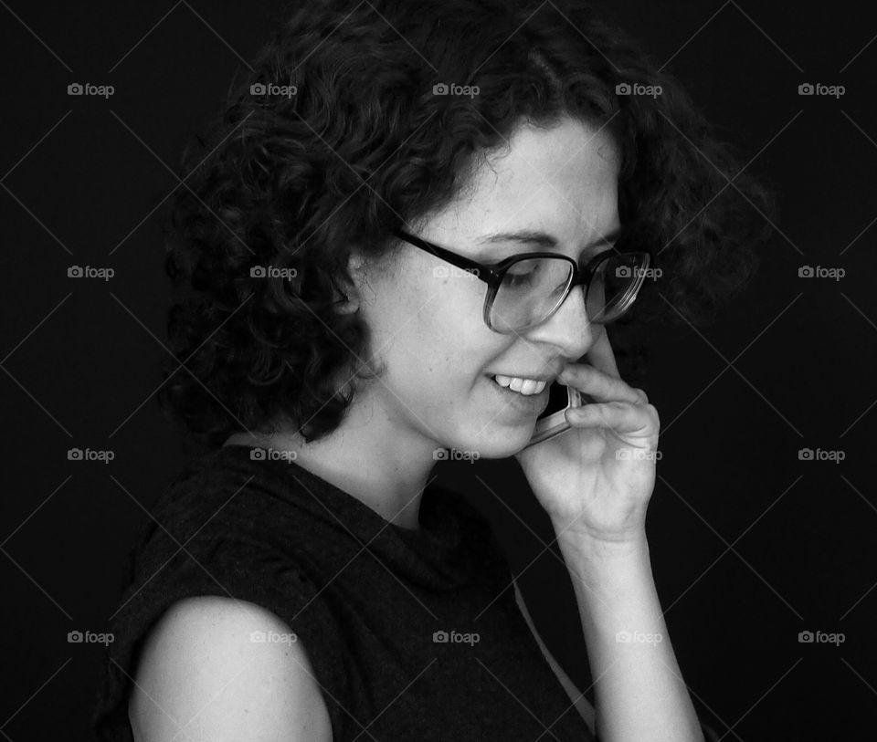 Bussiness on phone. Woman talking at phone in company