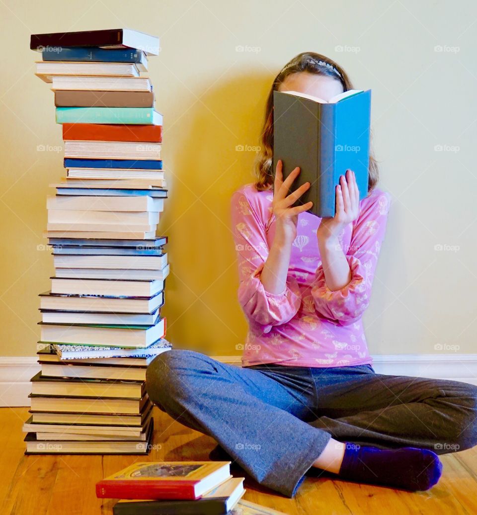 Book worm loves to read - the hobby of books and reading 