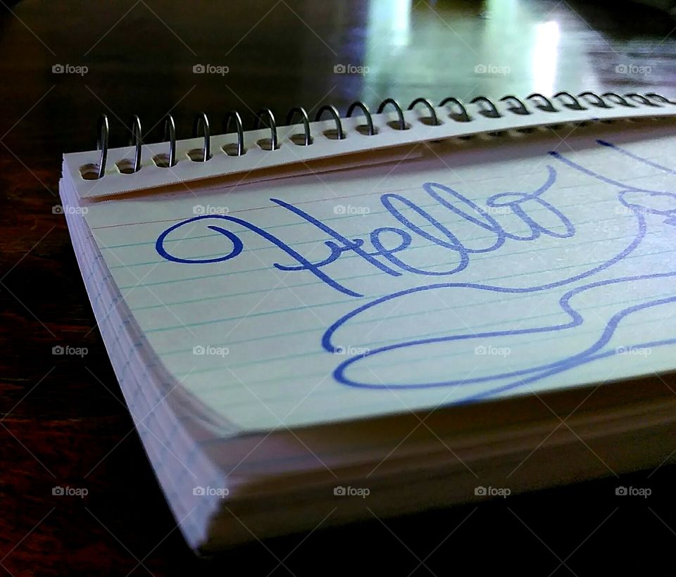 Random photo of a notepad with writing on it.