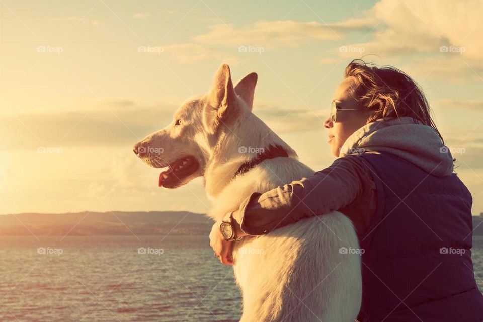 Rear view of a woman with her pet