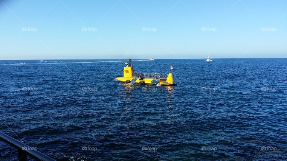 Yellow Submarine In Ocean Water On A Clear Day