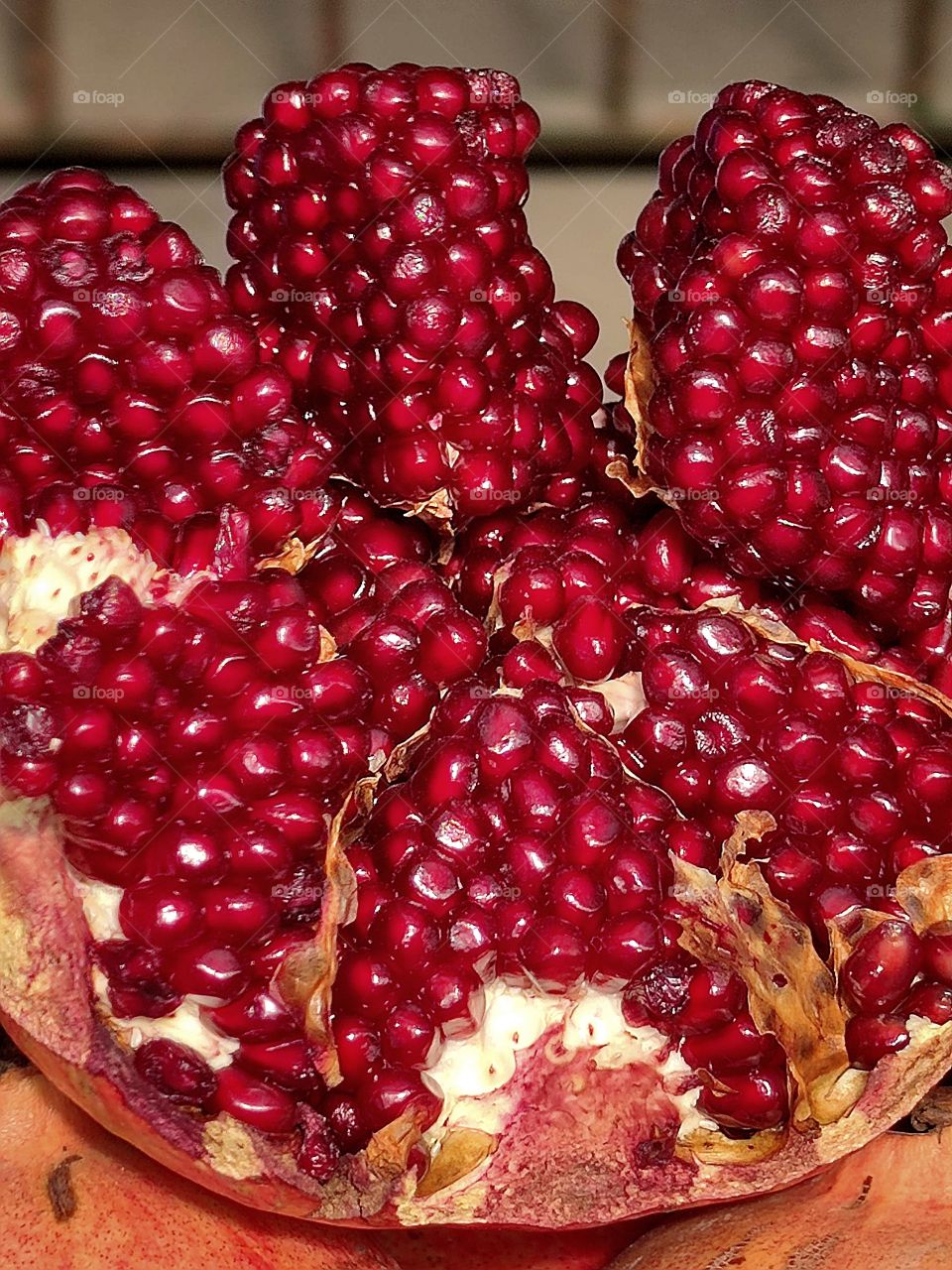 ripe pomegranate.  red pomegranate seeds.