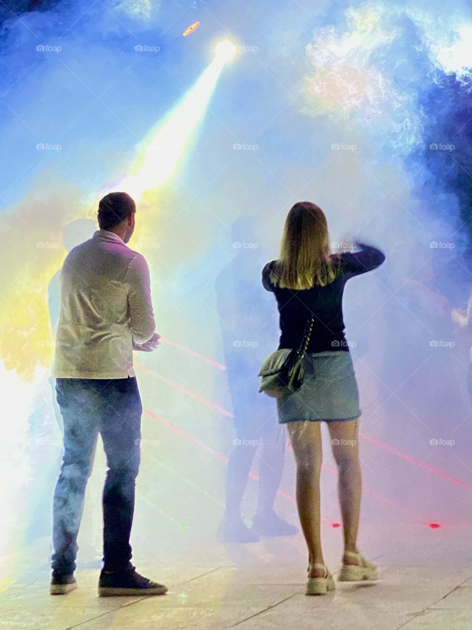 Back view of girl and boy on the dancing 