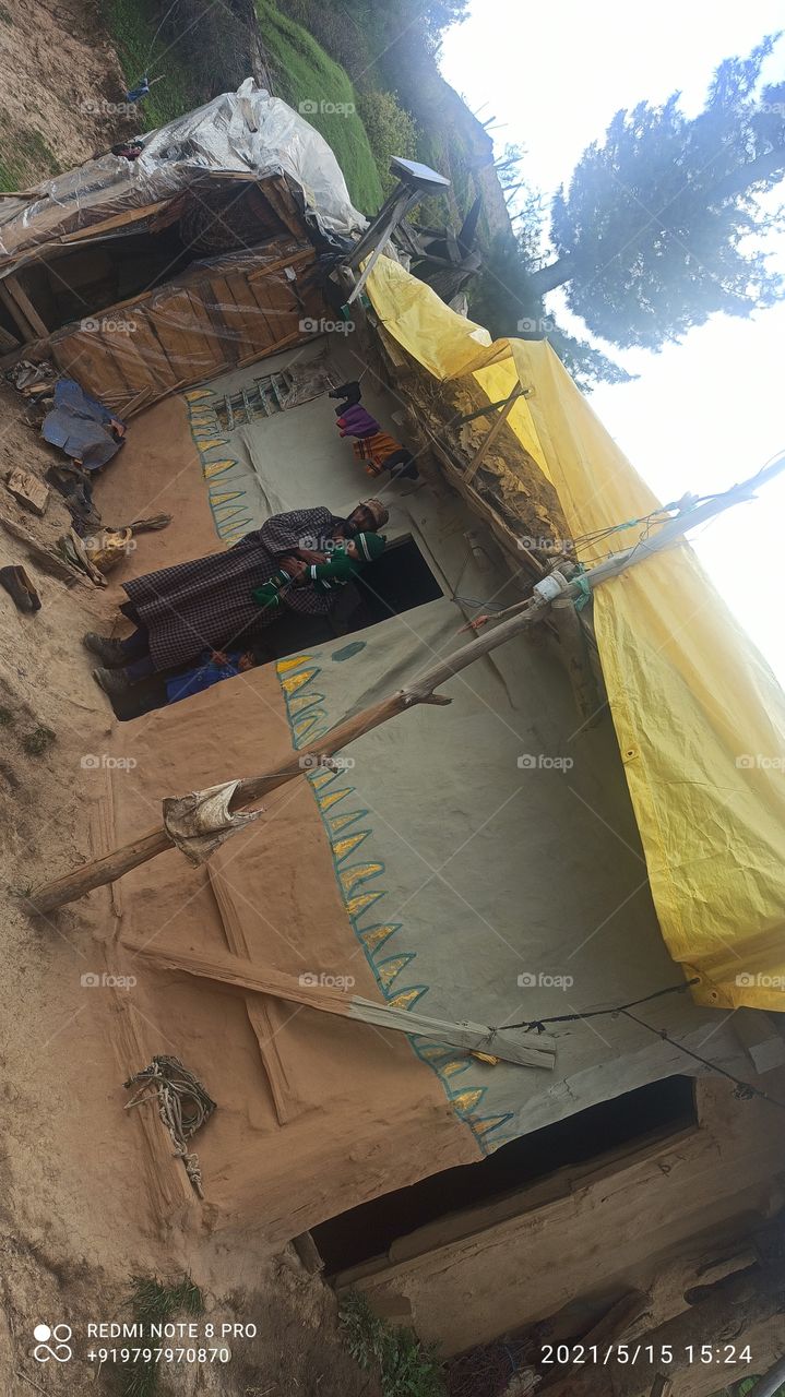 A typical house in forest area  of Hill district Shopian  having mud roof in kashmir valley....