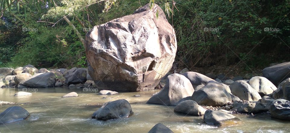 The big rock in the middle of the river