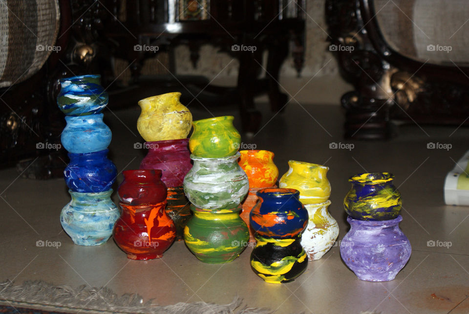 Pots coloured in bright colours to brighten up the room.