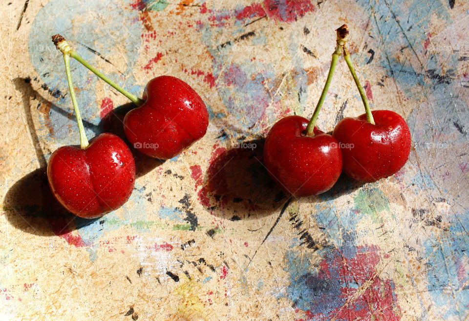 Cherries on colorful background 3