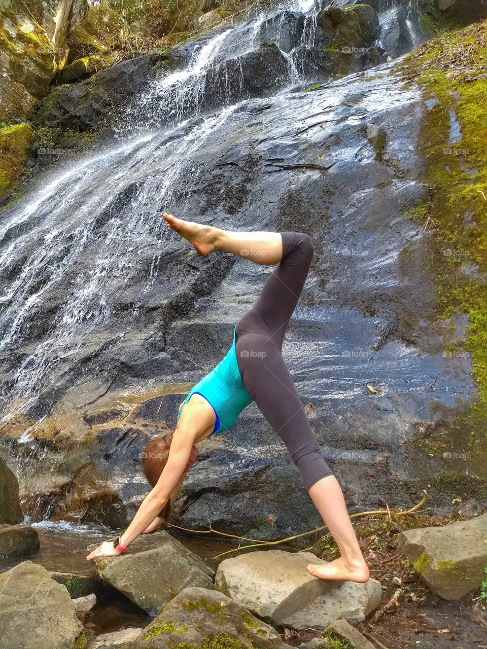 yoga pose by waterfalls