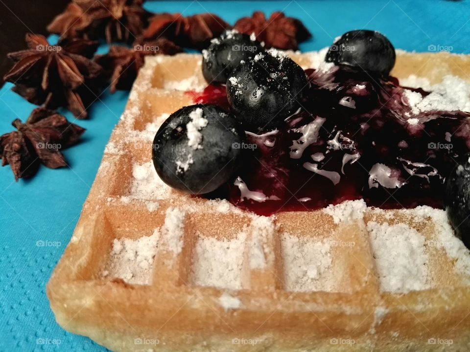 Healthy Christmas sweets with fruits, jam and dark chocolate on a rustic background