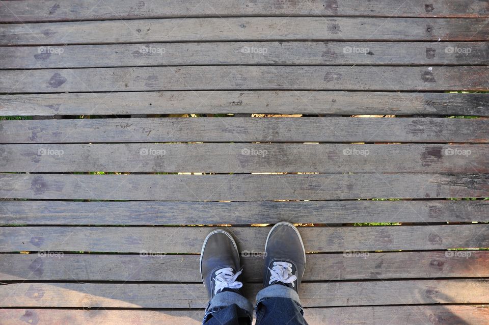 Wooden and a pair of shoe background. Top view.