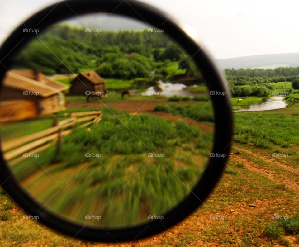 Polish village on Siberia seen through the magnifier, Russia