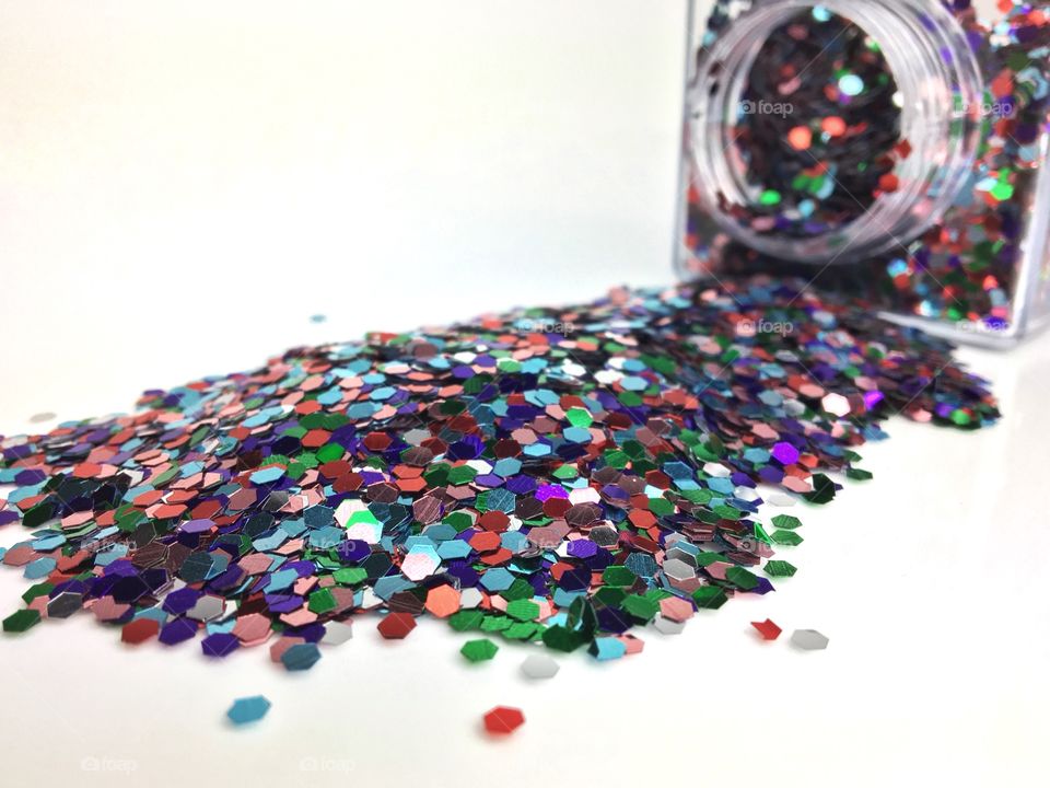 Glitter pouring out of jar