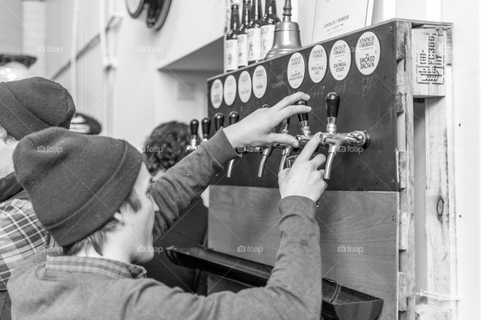 beer tapping. pouring some beer at a brewery in London