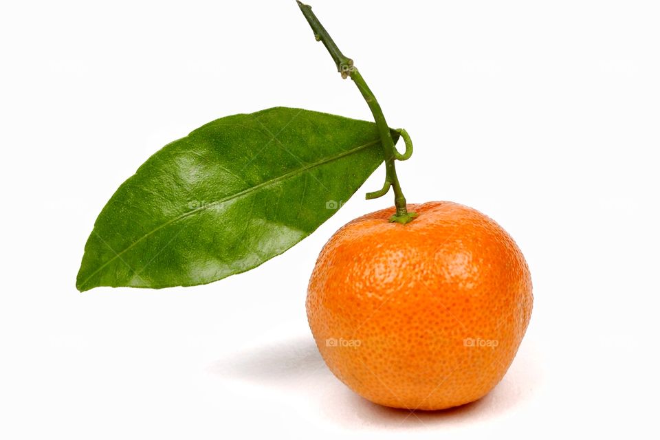 Orange tangerine with green leave 