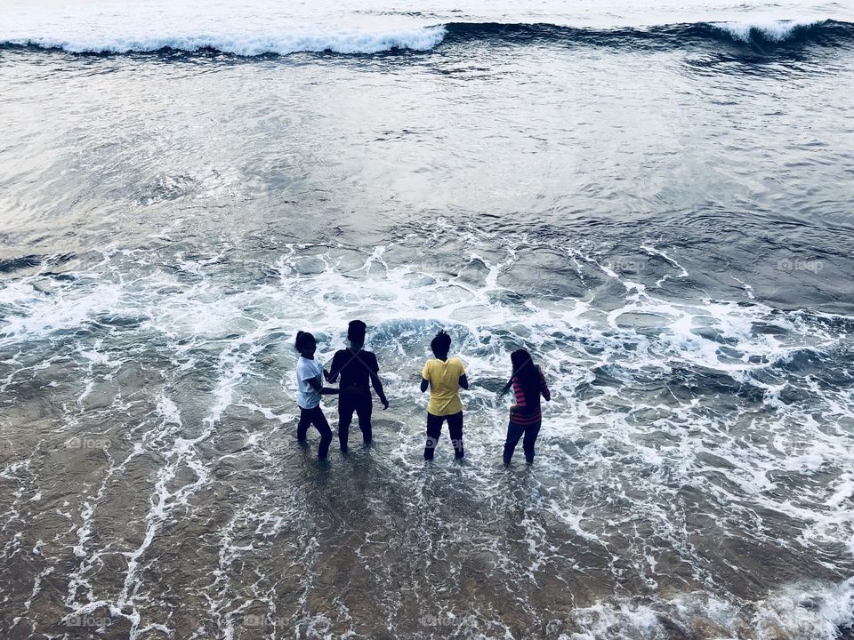 Kids on the seashore in Colombo, Sri Lanka 