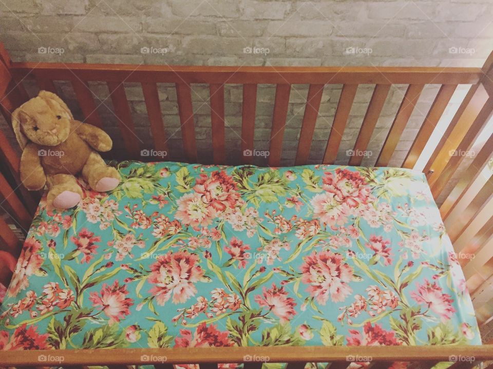 Teddy bear on crib