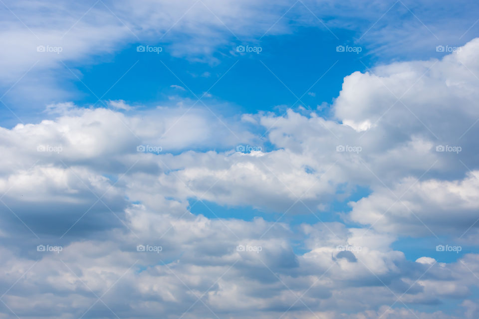 The beauty of the sky with clouds and the sun.