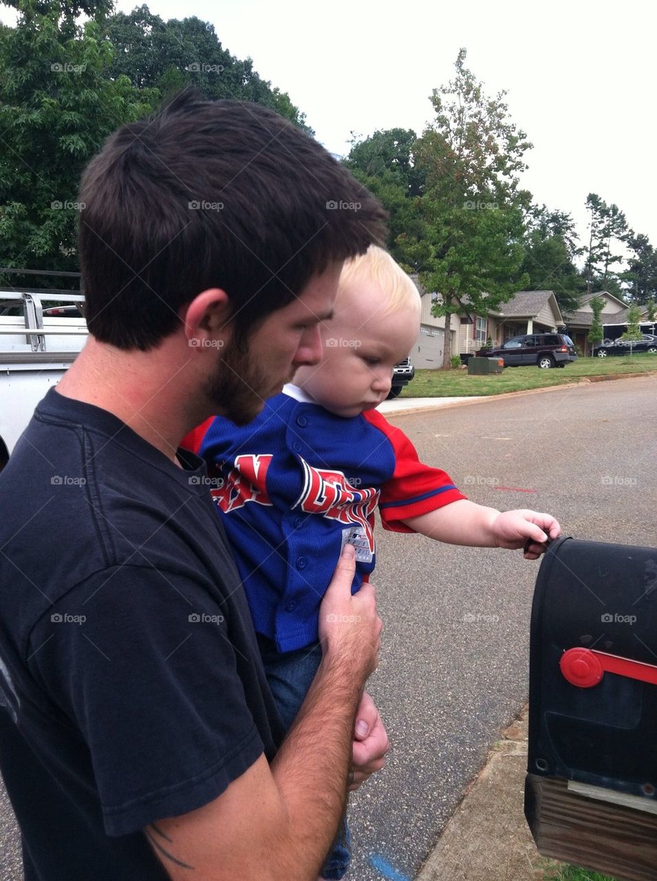 Daddy and son checking the mail