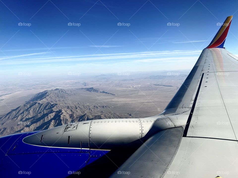 Flying over Estrella Mountain Regional Park in Goodyear Arizona about to land at Phoenix Sky Harbor International Airport (PHX)