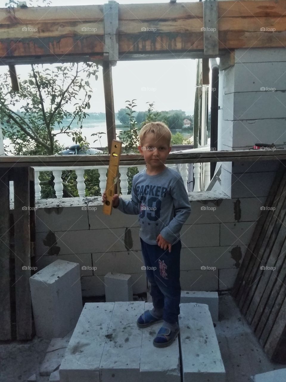 child builder with level in hands