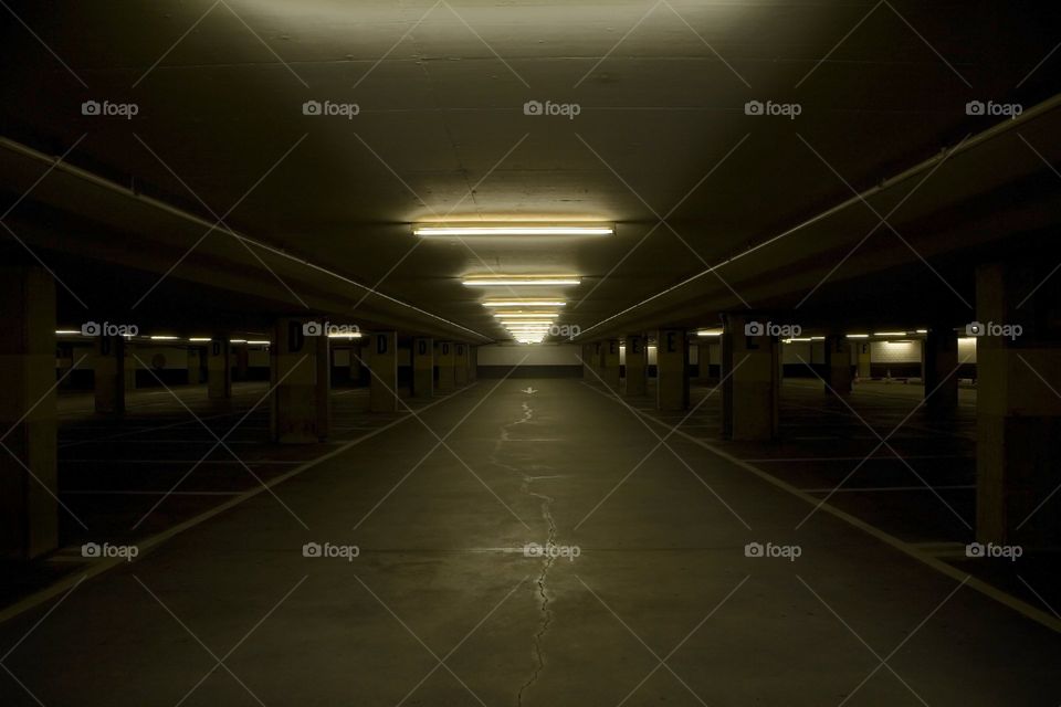 Dimly lit parking garage / parkade / car park