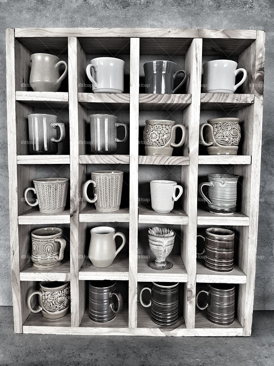 vintage mugs and pottery on wooden cube self