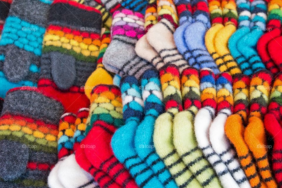 Colorful knitted socks and mittens