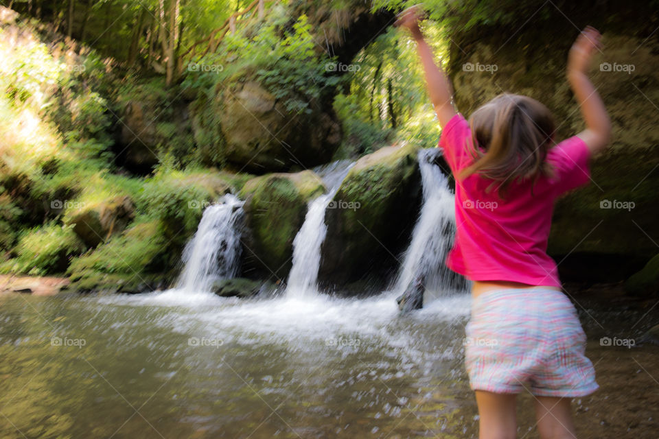 Luxembourg Murathel waterfalls, jumping girl