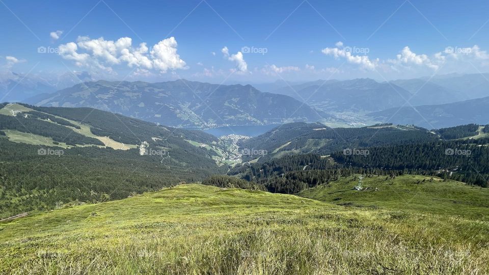 Panoramic landscape view from Schmitten Austria, view of zell am see and mountain peaks, perfect place to go hiking in 