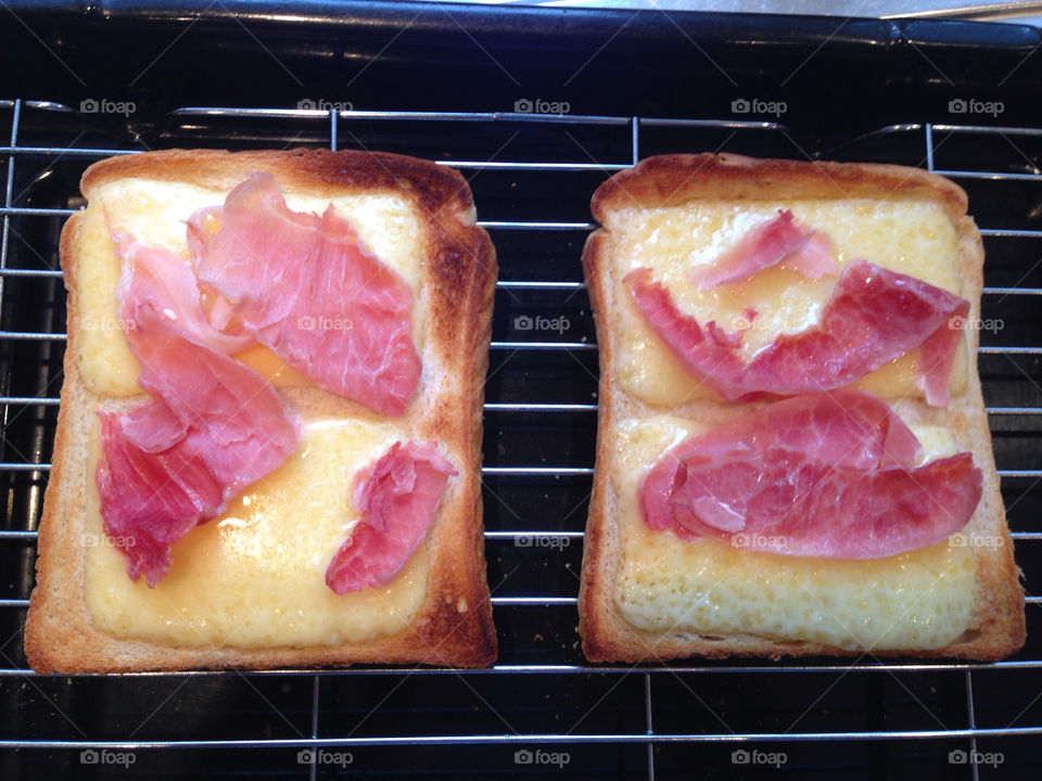 Cheese and ham on toast . Lunch 

