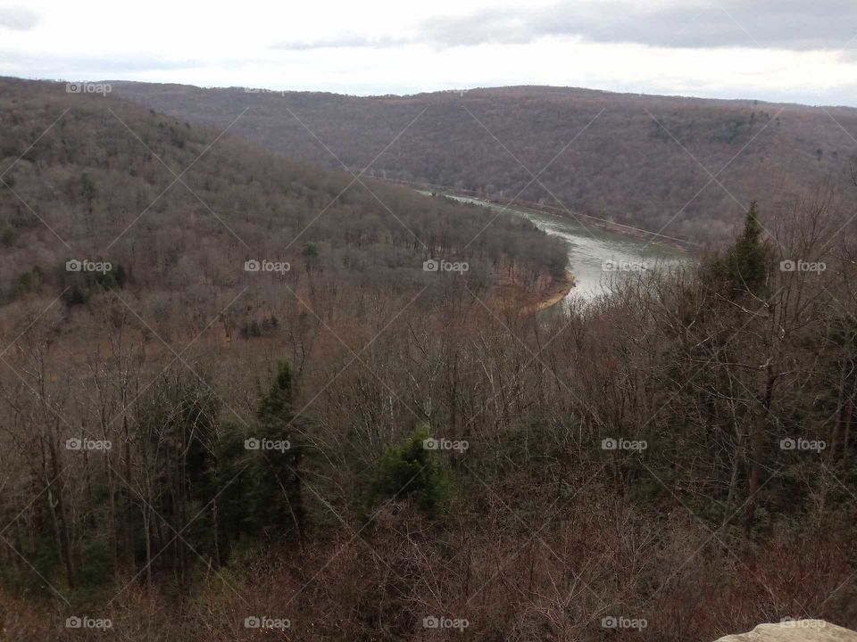 river valley winter scene no snow. trees no leaves. river bends around hills. Allegheny River kennerdell pa