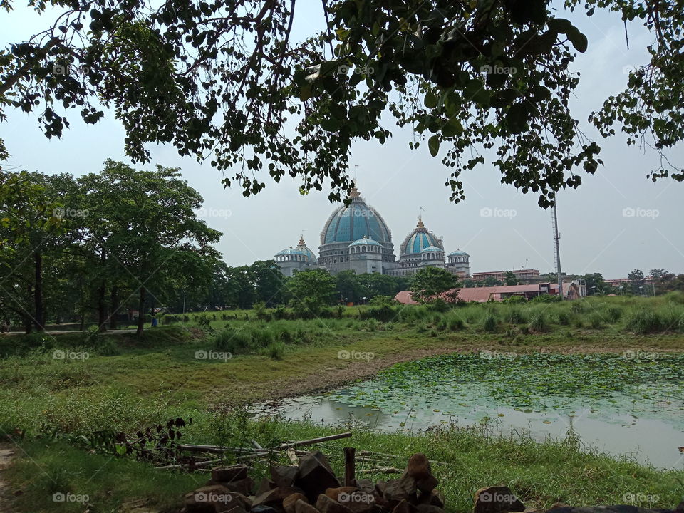 The new ISKCON Temple which is situated in the beautiful hamlet of Mayapur, West Bengal, India is a
 marvellous piece of architecture surrounded by lush greenery. The sky-coloured domes are topped with Russian gold minarets each costing in millions!