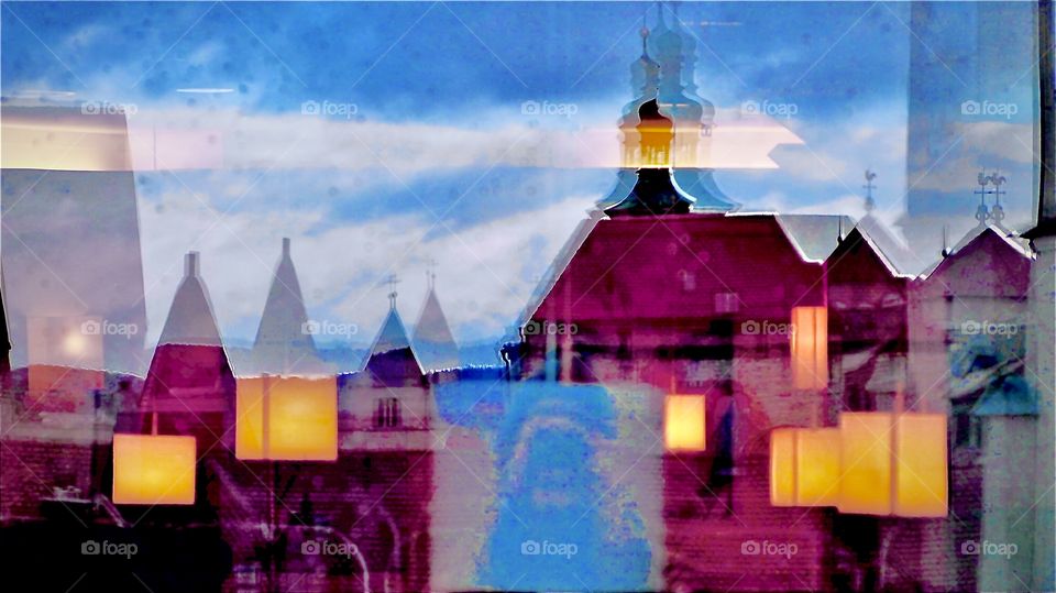 Window pane reflections layered on top of one another. This picture was taken in Regensburg, Germany around Christmas time in 2019. Hypnotic Productions