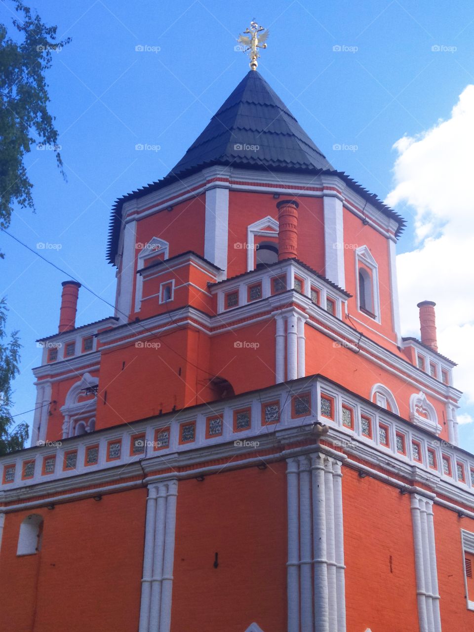 Orange tower and blue sky.  Orange and blue