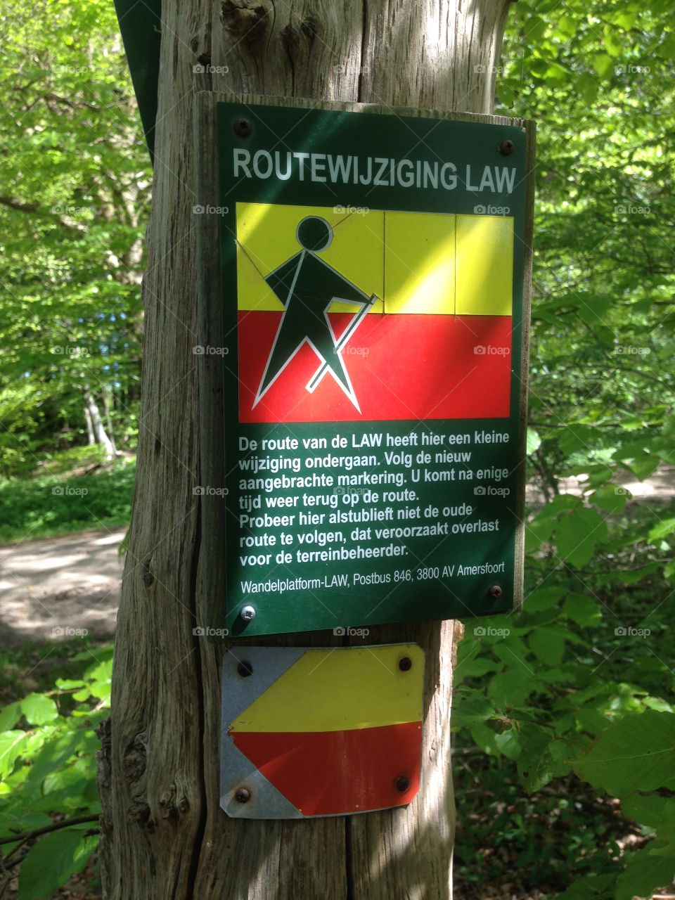 Red and yellow route marker of the hiking trail Drenthe pad in the Netherlands where the route has been diverted.