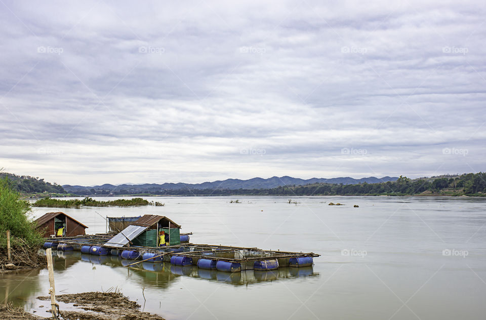 The raft floating fish farming and sky on the Mekong River at Loei in Thailand.