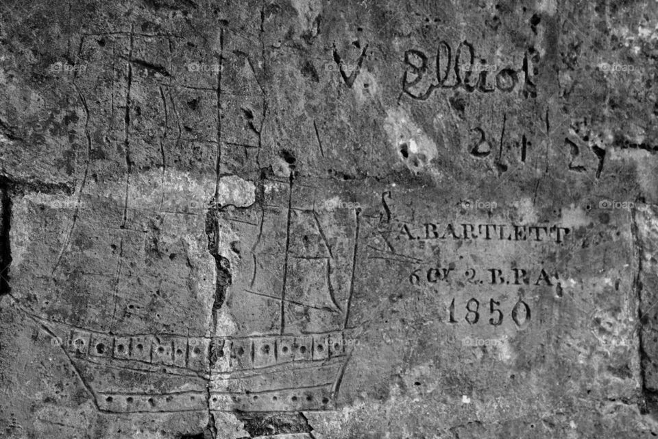 Names carved into the wall of a fort built in the 18th century