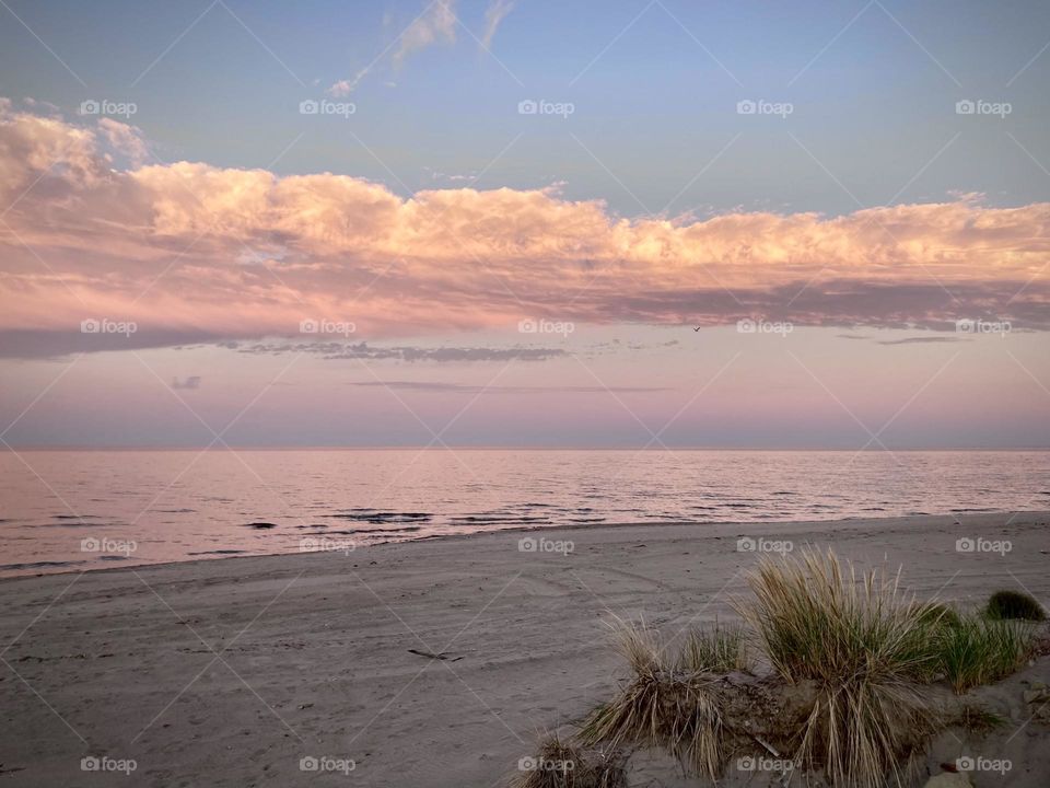 Lake Eerie purple and pink sunset from Sandy beach near Cedar Point