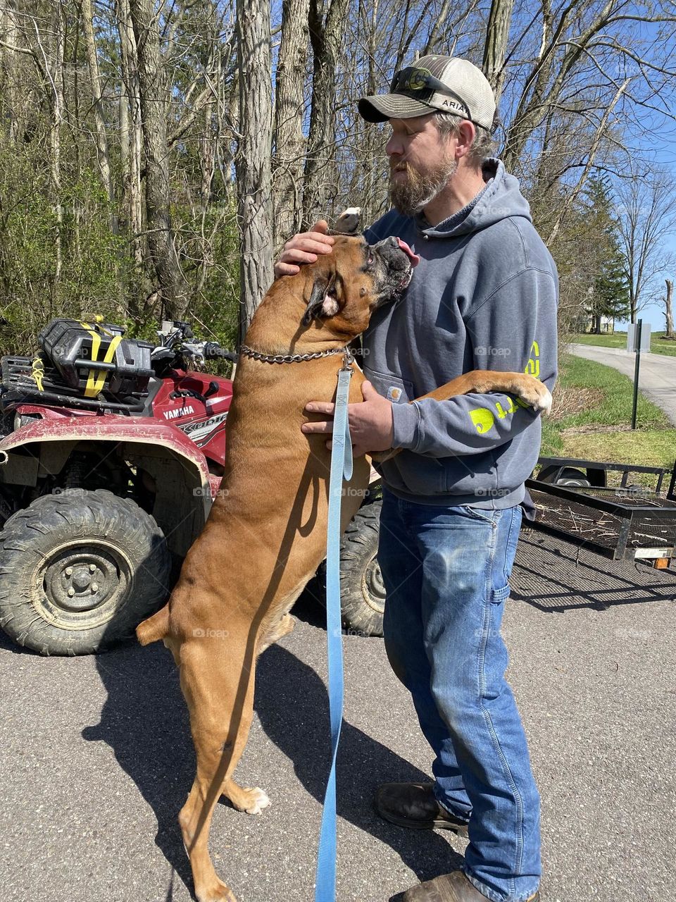 Dog giving his owner a hug